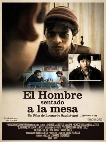 El hombre sentado a la mesa afişi